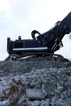 Demolishing a building with hydraulic crushers