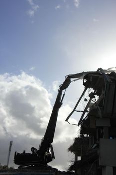 Demolishing a building with hydraulic crushers