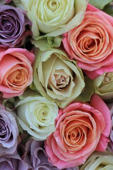 Mixed floral wedding decoration: roses in various pastel colors