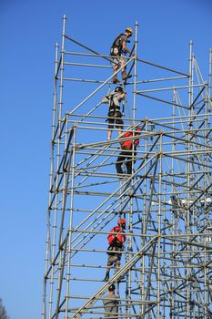 Construction workers setting up a new scaffolding