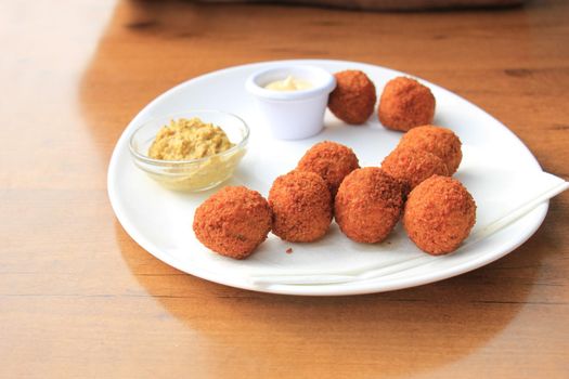 Bitterballen with mustard, warm fried snack, served in the Netherlands