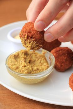 Bitterballen with mustard, warm fried snack, served in the Netherlands