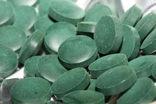 Medical green round vitamins spirulina platensis healthy super food close up background high quality big size prints