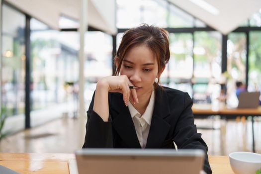 Image of business woman stressed while reading financial document