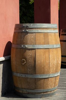 Antique wooden barrel used for street decor of a summer cafe.