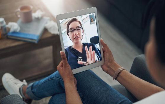 Technology makes everything accessible. an unrecognizable person on a videocall with a doctor