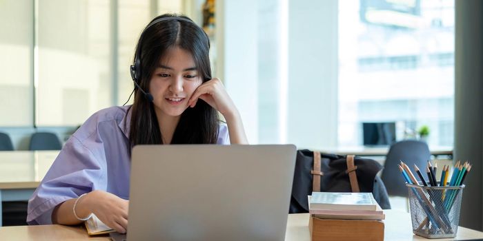 Homeschool Caucasian cute young girl student learning virtual internet online class from school teacher by remote meeting due to covid pandemic. Male teacher teaching math calculus by using whiteboard.