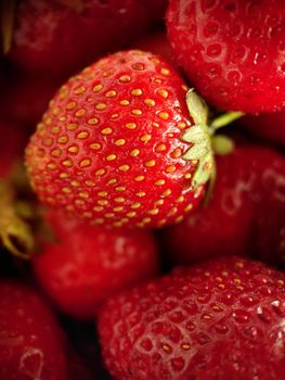 Macrophotography. Ripe red strawberries, top view.Texture or background