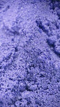 Macrophotography.Sand granules of lilac color . Sand patterns.Texture or background