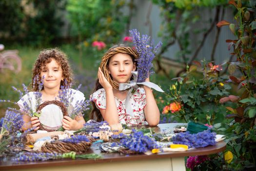 Girls make homemade lavender wreaths as a decor for home or present