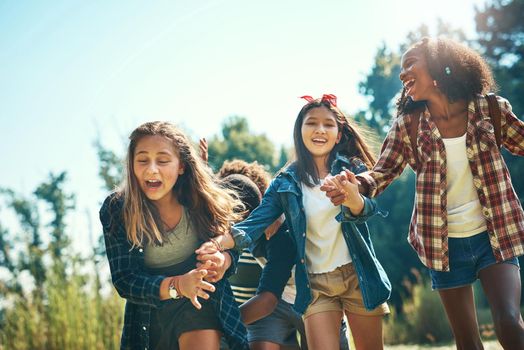 Hold onto your hats, summer camp is here. a group of teenagers having fun at summer camp