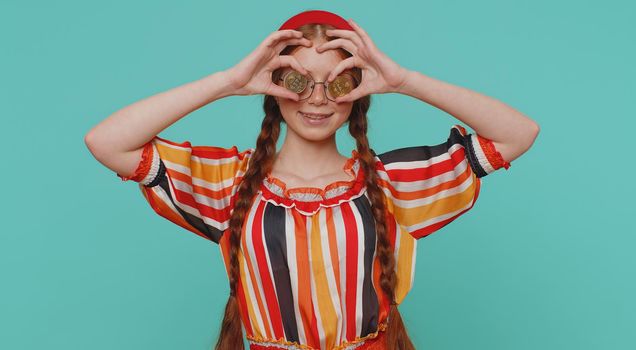 Redhead Girl Winner Showing Golden Bitcoins. Career Wealth Cryptocurrency Investment Mining Future Technology. Young Ginger Child Fooling Making Faces. Happy Businesswoman Isolated On Blue Background