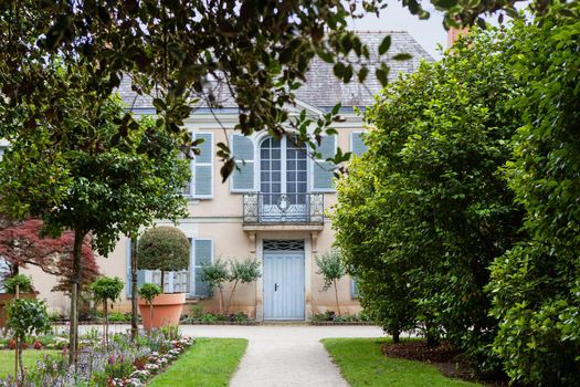 Public French house in a luxuriant park