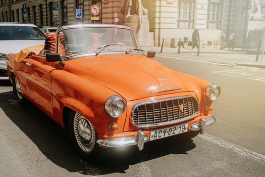 Prague, Czech Republic - July, 2022. Skoda automobile, 450 orange roadster, produced from 1957 to 1959, retro model of car. Vintage style. High quality photo