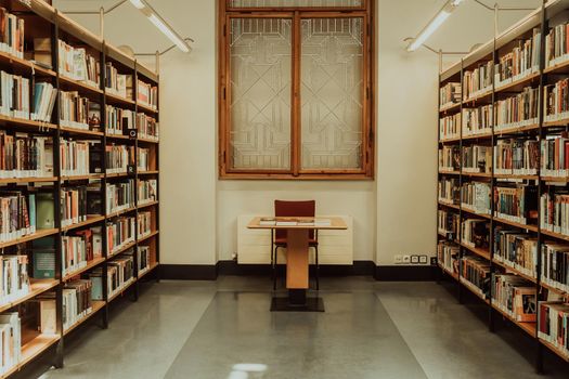 Prague, Czech Republic - July, 2022. Public Municipal Library with colorful paper books on shelves. Education, science, literature concept. High quality photo