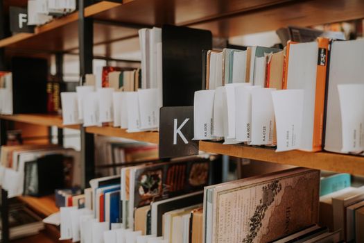 Prague, Czech Republic - July, 2022. Public Municipal Library with colorful paper books on shelves. Education, science, literature concept. High quality photo