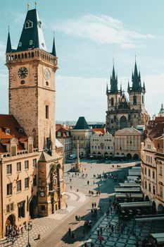 Old Prague town square with Church of our Lady before Tyn, astronomical chimes. Famous historical, gothic style buildings. Sunny cityscape in european capital. High quality photo