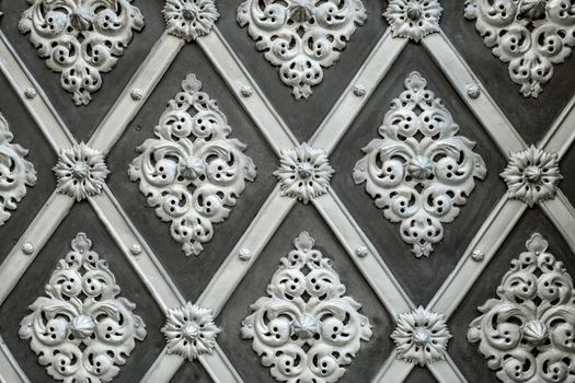 Seamless grey decorative forged overlays door gate texture in Prague. Incredible stucco, details of old european architecture. Perfect for mock-up and design. High quality photo