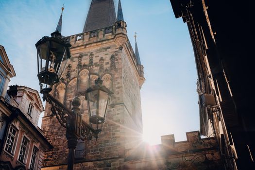 Famous medieval Charles - Karlov bridge across Vltava river. Historic, old district of european capital. View of town hall tower. High quality photo