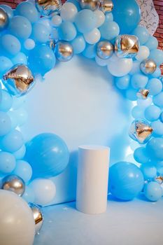 Photo zone with balloons. Boy's birthday decor. Festive decoration. Balloons. Childrens party background. Festive photo zone in blue.