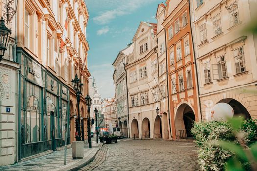 Prague, Czech Republic - July 2022. Beautiful cozy narrow street in old town. Amazing european architecture, historical facades of traditional buildings. High quality photo