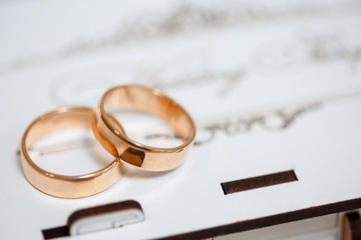 Gold wedding rings for newlyweds on wedding day