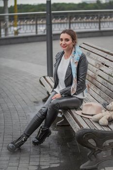 woman sitting on a bench in the city