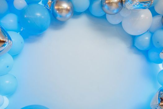 Photo zone with balloons. Boy's birthday decor. Festive decoration. Balloons. Childrens party background. Festive photo zone in blue.