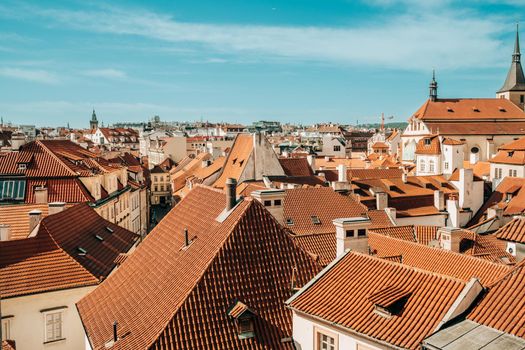 View from terrace on Prague buildings roofs with typical traditional red roof tiles. Czech republic, european city. High quality photo