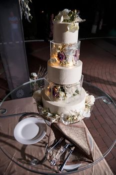 Beautiful tiered delicious dessert sweet cake for the holiday. Selective focus