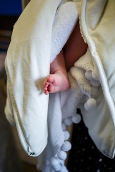 Baby feet on a white towel, baby foot, baby baptism