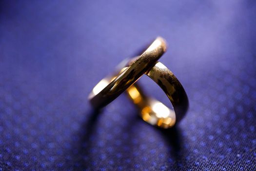 Gold wedding rings for newlyweds on wedding day