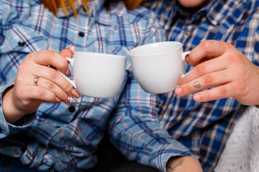 Man and woman cup of coffee tenderness love