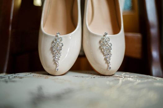White women shoes, silver earrings