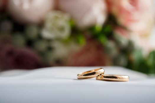 Gold wedding rings for newlyweds on wedding day