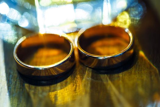 Gold wedding rings for newlyweds on wedding day