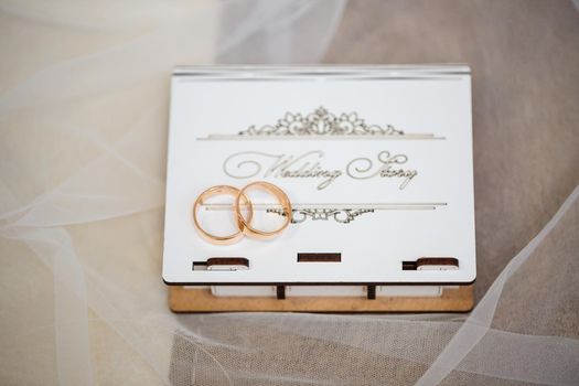 Gold wedding rings for newlyweds on wedding day