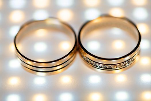 Gold wedding rings for newlyweds on wedding day