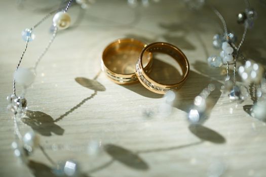 Gold wedding rings for newlyweds on wedding day