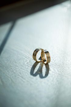 Gold wedding rings for newlyweds on wedding day