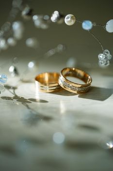 Gold wedding rings for newlyweds on wedding day