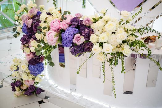 Wedding decor made of flowers and fabric. Beautiful decorations for newlyweds on their wedding day