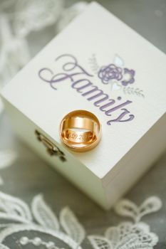 Gold wedding rings for newlyweds on wedding day