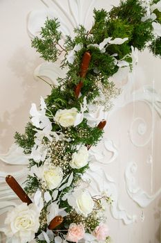 Wedding decor made of flowers and fabric. Beautiful decorations for newlyweds on their wedding day