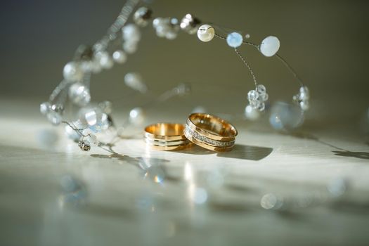 Gold wedding rings for newlyweds on wedding day