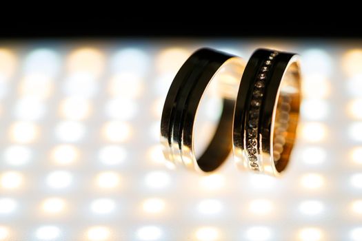 Gold wedding rings for newlyweds on wedding day