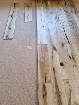 A parquet floor made of wood while it is being freshly installed