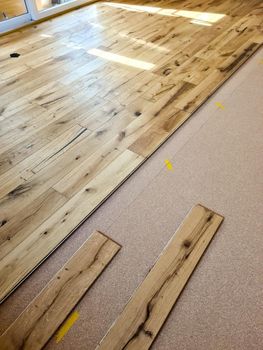 A parquet floor made of wood while it is being freshly installed