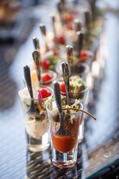 Buffet table for guests at a banquet with various snacks and sandwiches. Selective focus