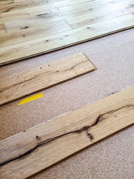 A parquet floor made of wood while it is being freshly installed